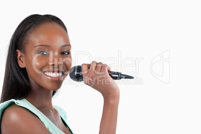 Happy smiling woman with microphone