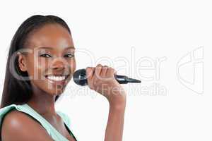 Happy smiling woman with microphone
