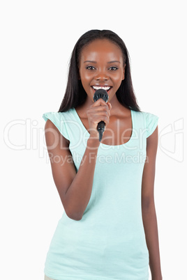 Brightly smiling young female singer