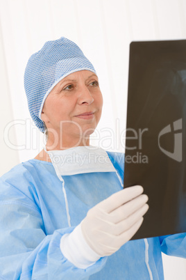 Senior surgeon female hold x-ray protective overall