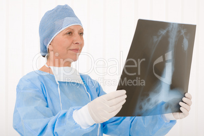 Senior surgeon female hold x-ray protective overall