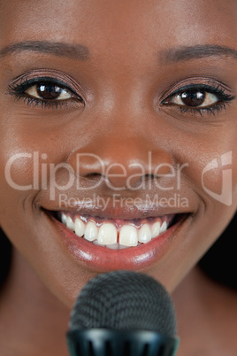 Close up of cheerful smiling female singer