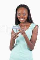 Happy smiling female destroying credit card