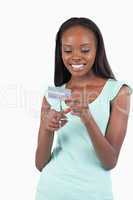 Happy smiling young female destroying credit card