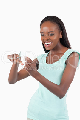 Angry woman cutting her credit card into pieces