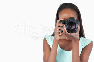 Young female photographer at work
