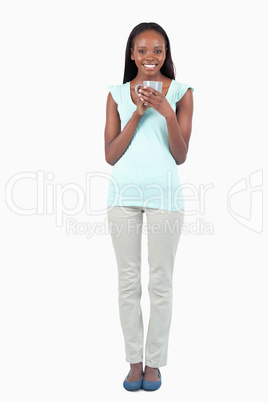 Smiling young woman with a cup of coffee