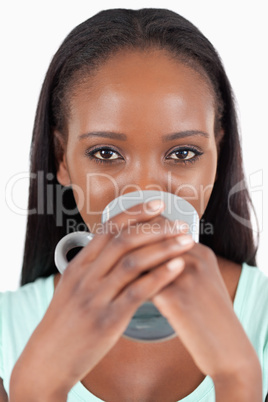 Close up of woman drinking coffee