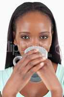 Close up of woman drinking coffee