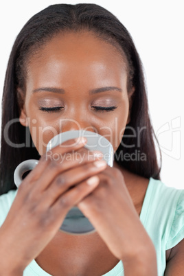 Close up of woman enjoying a cup of coffee