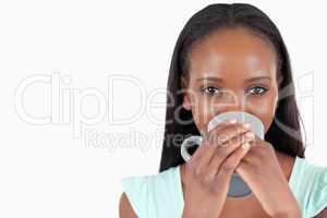 Young woman relaxing with a cup of tea