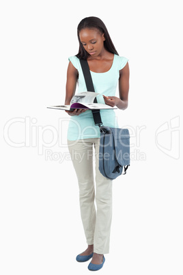 Young student having a look at her book