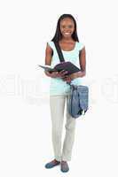 Smiling young student with her book