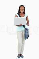 Smiling young student with her notebook