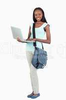 Side view of female student with her laptop