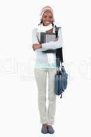 Smiling young female student with her books