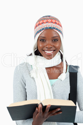 Close up of smiling student holding her book