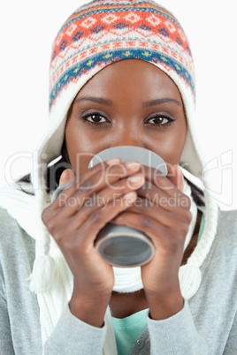Young woman enjoying tea in the cold
