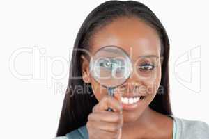 Young woman with magnifier