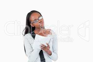 Young woman with glasses and notepad in thoughts