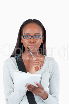 Young woman with notepad and glasses Young woman with notepad and glasses