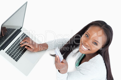 Smiling woman booking flight online