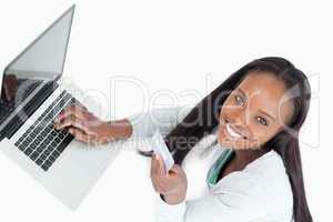 Smiling woman booking flight online