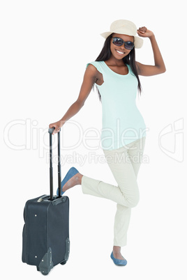 Happy smiling woman with her suitcase