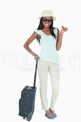 Smiling young woman going on vacation