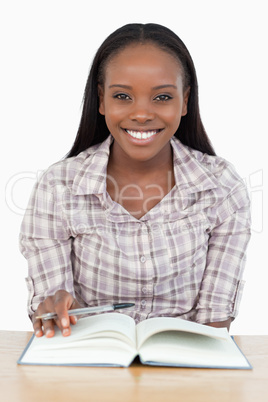 Smiling girl reading a novel