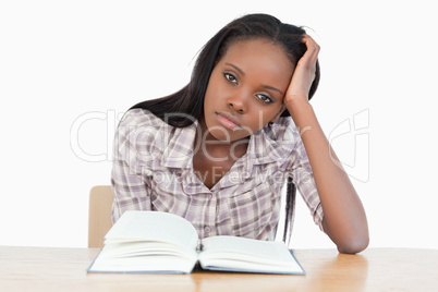 Student trying to read a book