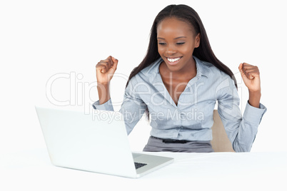 Cheerful businesswoman working with a notebook