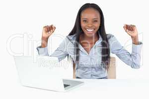 Cheerful businesswoman working with a laptop