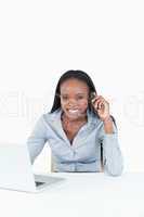 Portrait of a businesswoman making a phone call while using a no
