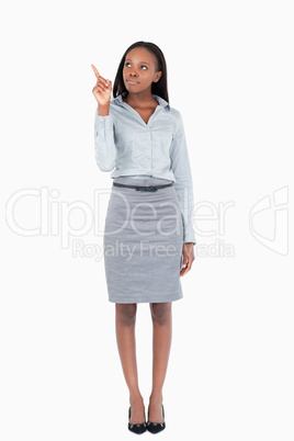 Portrait of a businesswoman pointing at a copy space