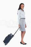 Portrait of a businesswoman with a suitcase