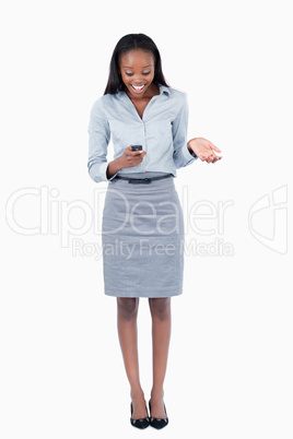 Portrait of a surprised businesswoman reading a text message