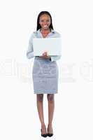 Portrait of a businesswoman using a laptop while standing up