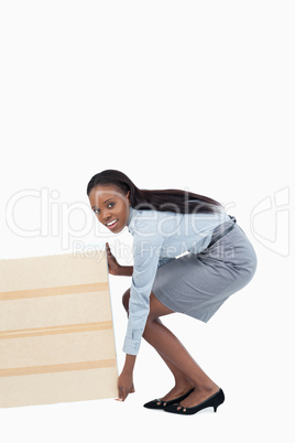 Portrait of a businesswoman dragging a panel
