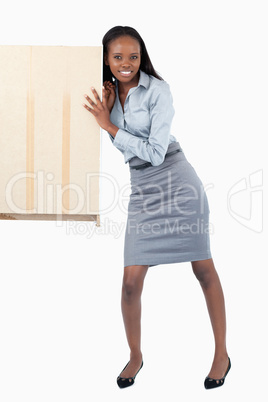 Portrait of a businesswoman pushing a panel