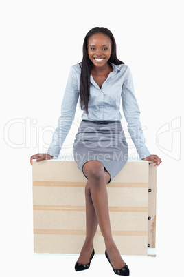 Portrait of a smiling businesswoman sitting on a panel