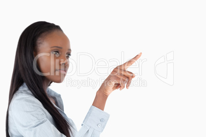 Businesswoman pressing an invisible key