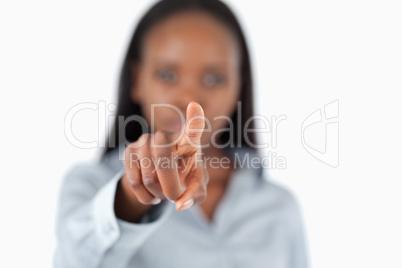 Businesswoman touching an invisible screen