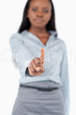 Portrait of a young businesswoman touching an invisible screen Portrait of a young businesswoman touching an invisible screen