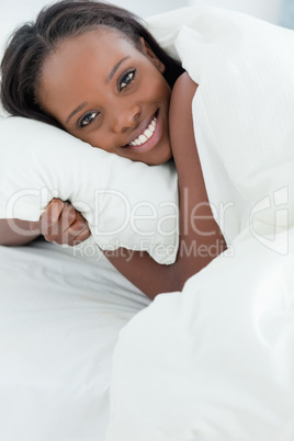 Close up of a delighted woman waking up