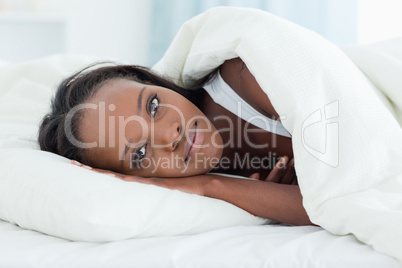 Delighted woman waking up