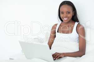 Woman using a laptop before sleeping