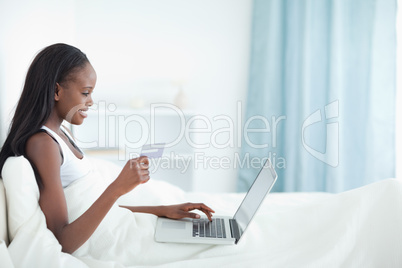 Smiling woman shopping online