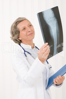 Senior doctor female happy hold x-ray