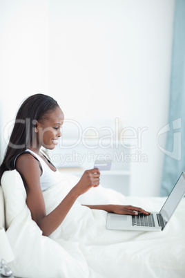 Portrait of a young woman shopping online